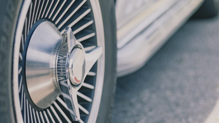 old chrome spikes wheel on a classic car design close up still